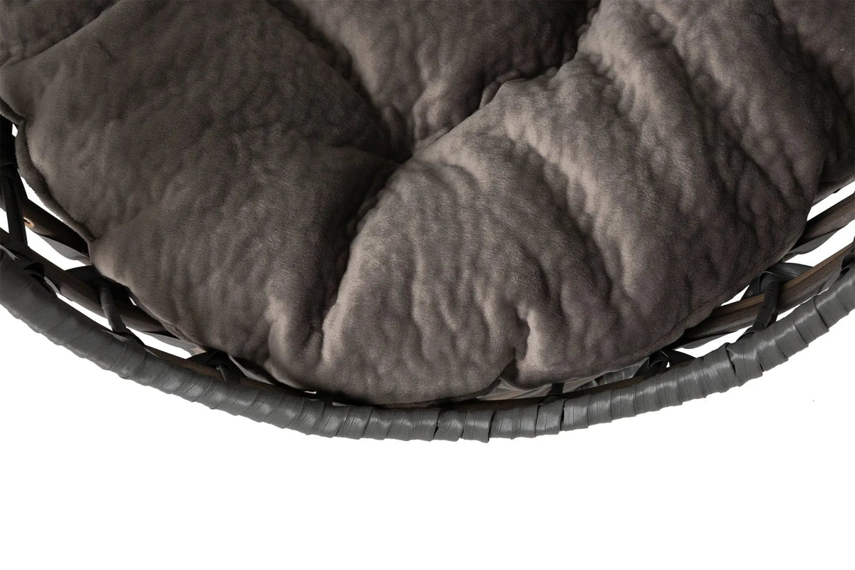 Close view of the plush smoky-gray tufted sleeping cushion