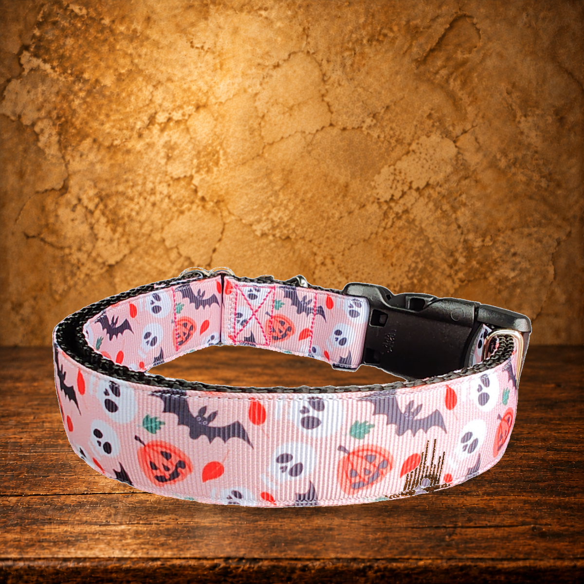 Spooky Friends Nylon Dog Collar displayed on the antique table
