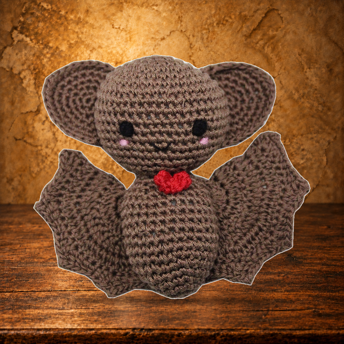 Bat Damon Crocheted Pet Toy displayed on the antique table