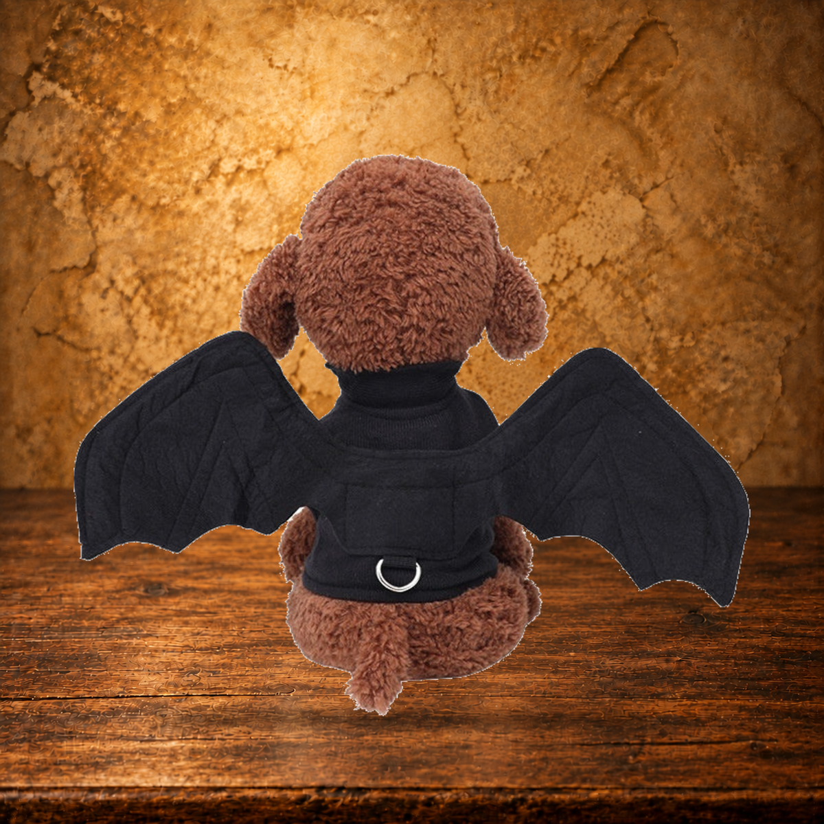 Black Bat Pet Costume Wings displayed on the antique table
