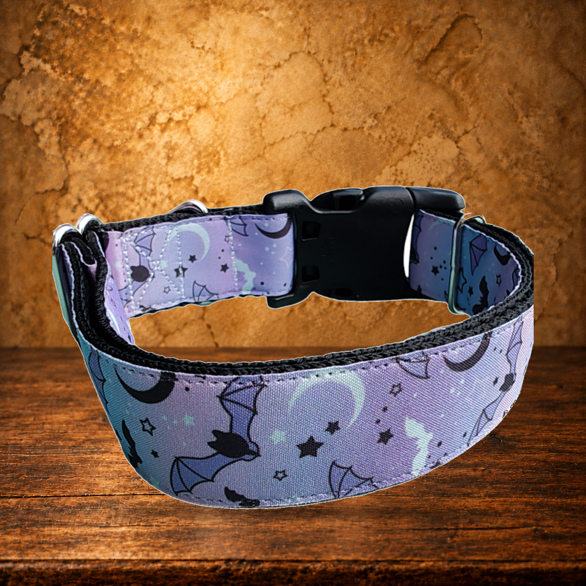 Purple Bats Nylon Dog Collar displayed on the antique table