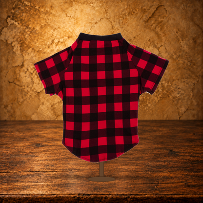Black & Red Plaid Dog Pajamas displayed on the antique table