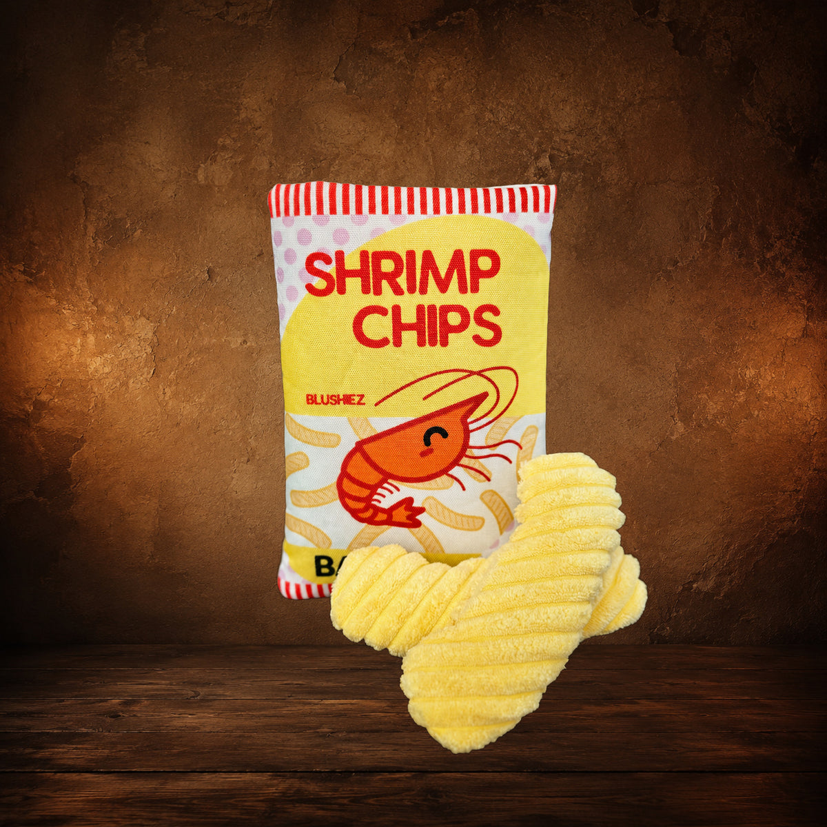 The Contraband Shrimp Chips — 2-Piece Crinkle Toy on an antique Pate’s Pugorium backdrop
