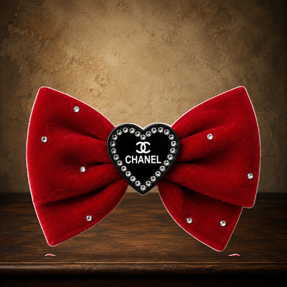 The Velvet Parlour Hair Bow displayed on the approved antique plaster and walnut table