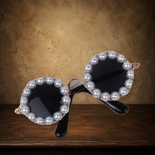 The Dowager’s Pearl Spectacles — Pet Sunglasses on the approved antique plaster and walnut backdrop