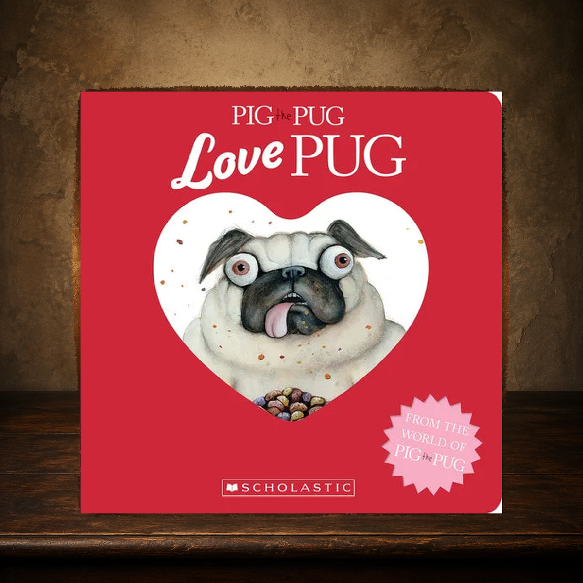 The Little Love Pug — Pig the Pug Board Book displayed on the approved antique plaster and walnut table