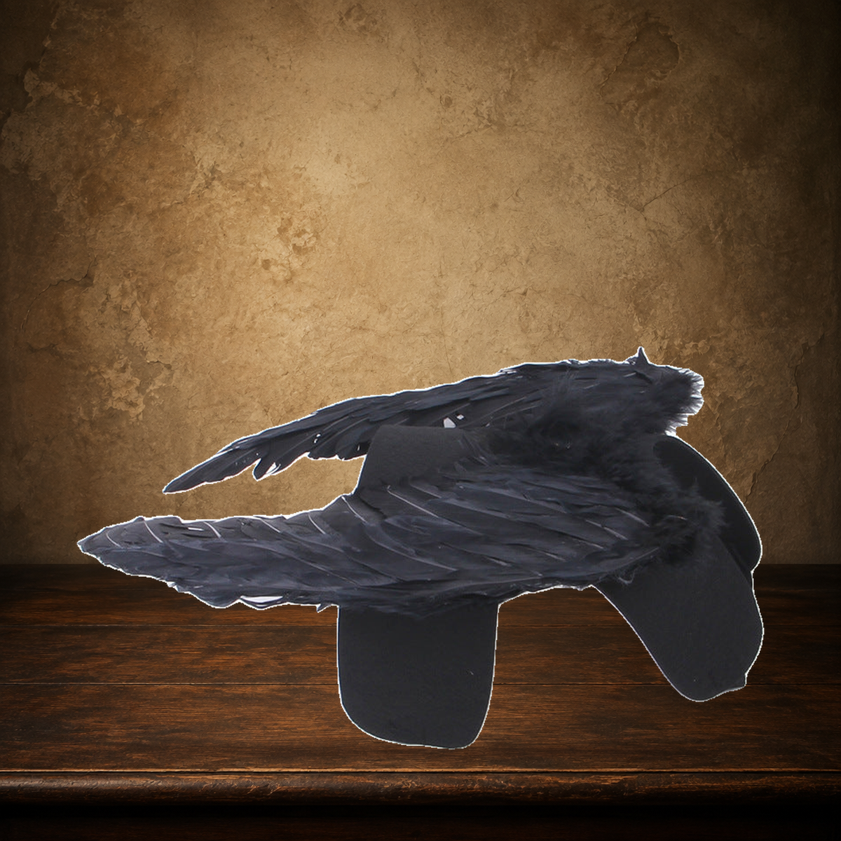 The Fallen Angel Pet Wings displayed on the approved antique plaster and walnut table