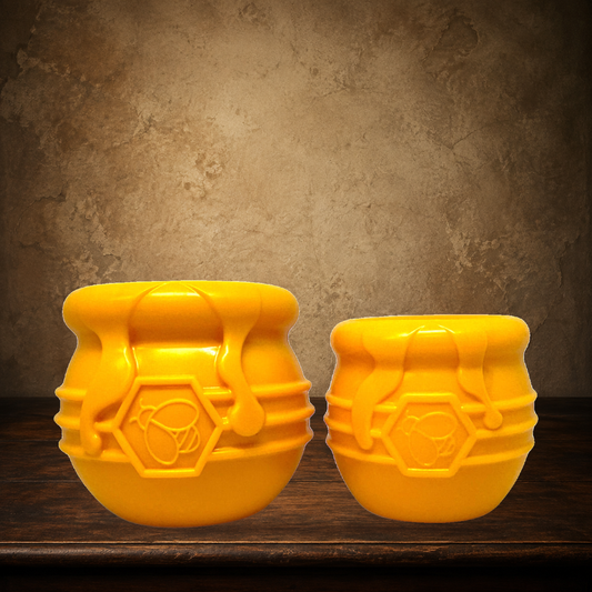 The Curious Honey Pot — Treat Dispenser displayed on the approved antique plaster and walnut table