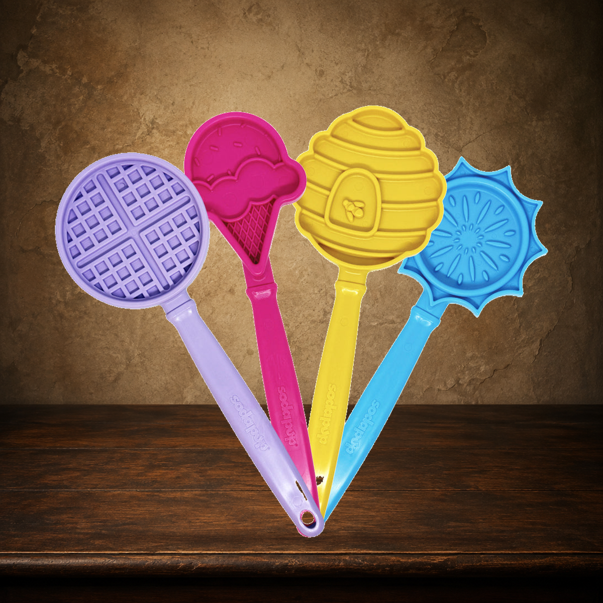 The Distraction Wand — Handheld Lick Toy displayed on the approved antique plaster and walnut table