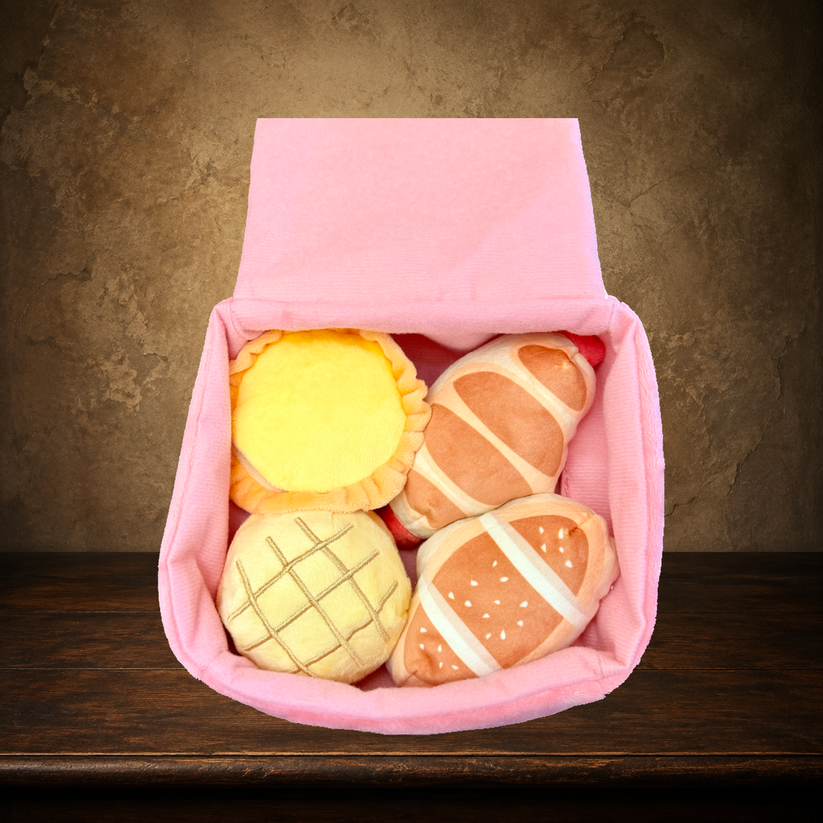 The Midnight Bakery Box — 5-Piece Nosework Toy displayed on the approved antique plaster and walnut table