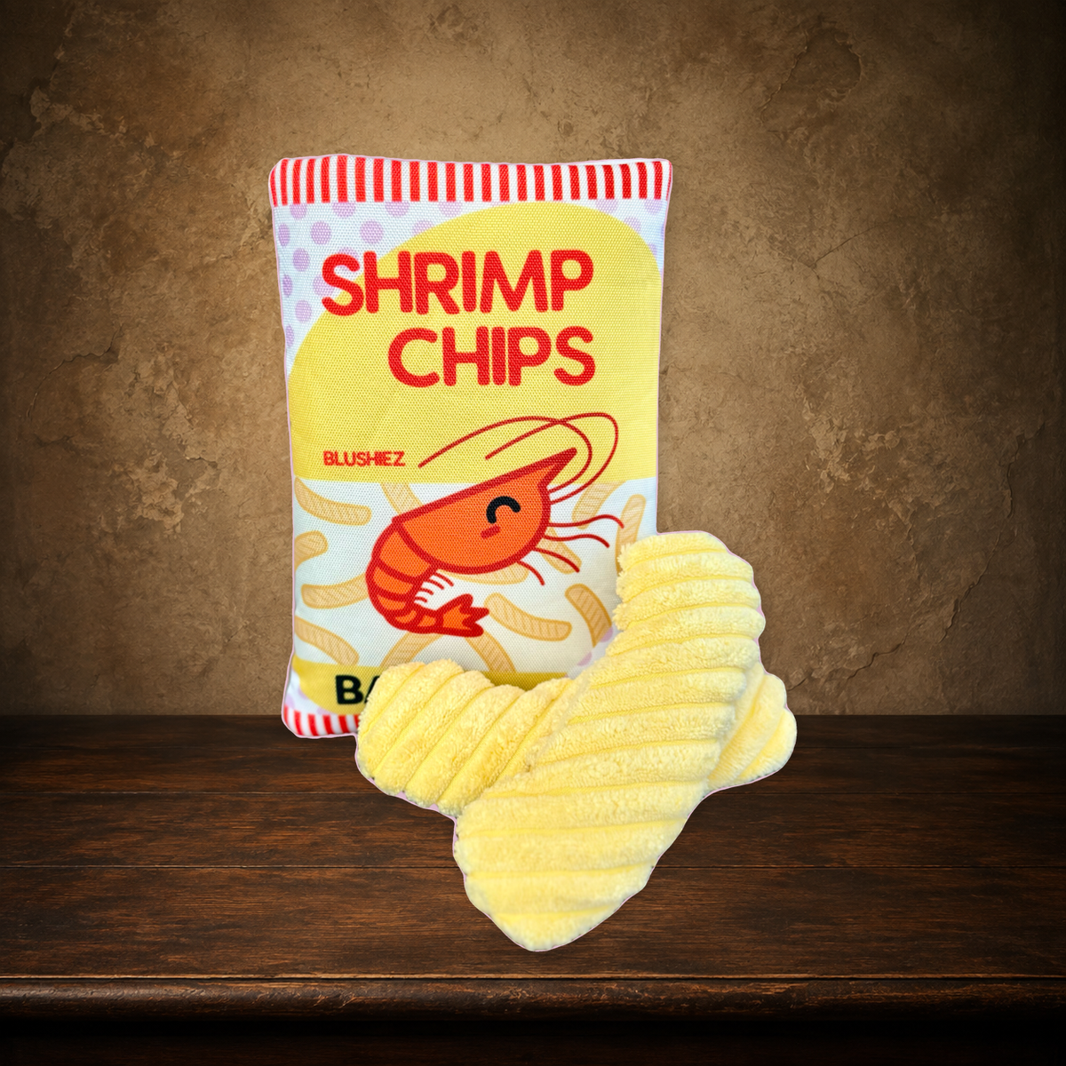 The Contraband Shrimp Chips — 2-Piece Crinkle Toy on the approved antique plaster and walnut backdrop