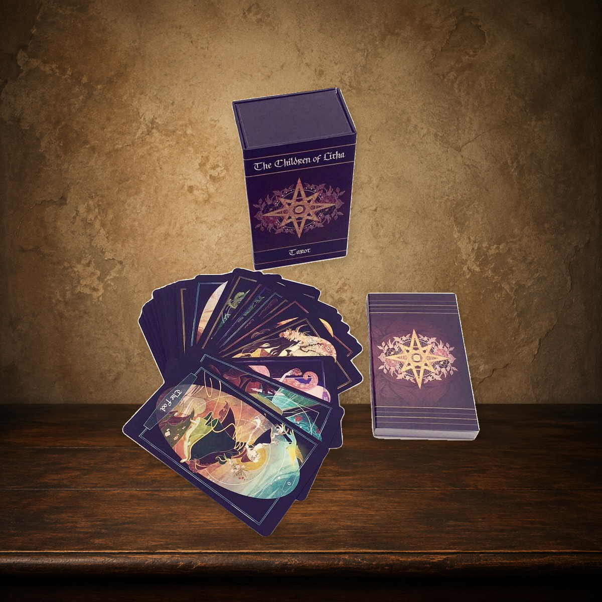 Children of Litha — Black Tarot & Book Set on the approved antique plaster and walnut backdrop