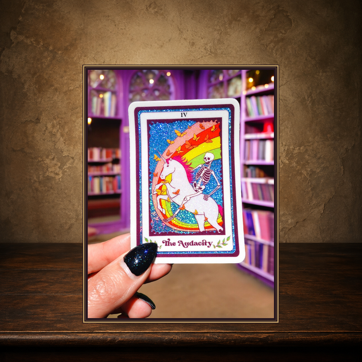 The Audacity Tarot Sticker displayed on the approved antique plaster and walnut table