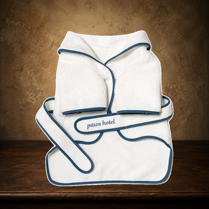 The Hotel Bathrobe Set displayed on the approved antique plaster and walnut table