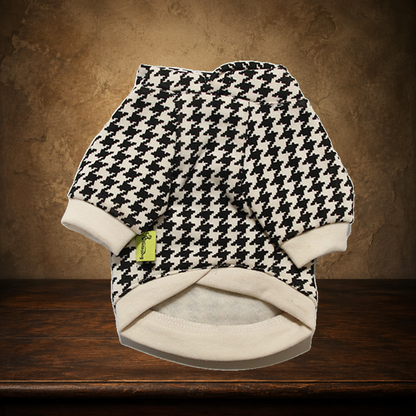 The Houndstooth Young Gentleman displayed on the approved antique plaster and walnut table