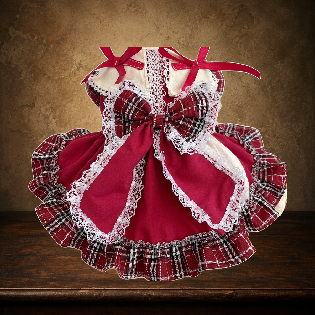 The Plaid Parlour Lolita Dress displayed on the approved antique plaster and walnut table