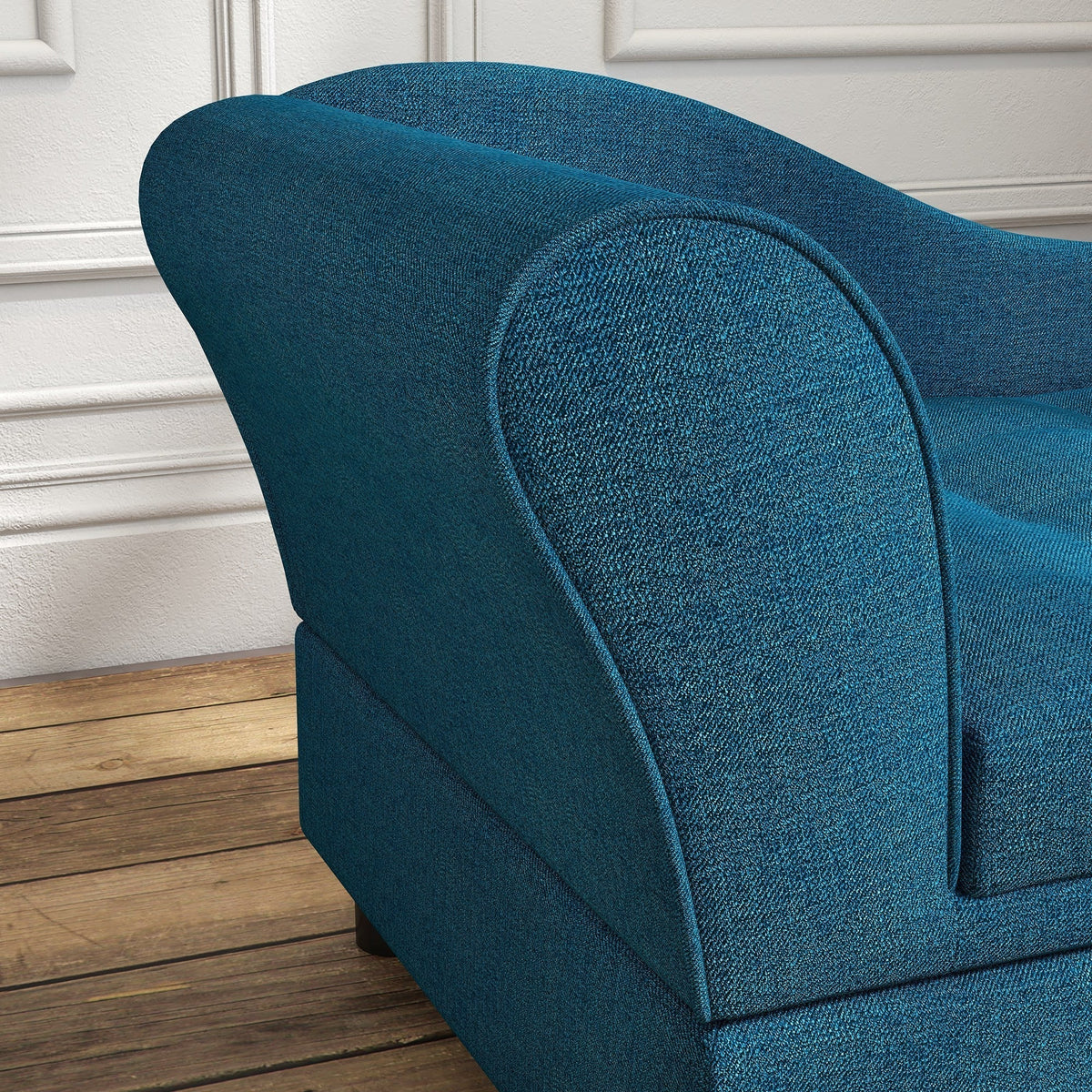 Close view of the curved back and teal woven upholstery