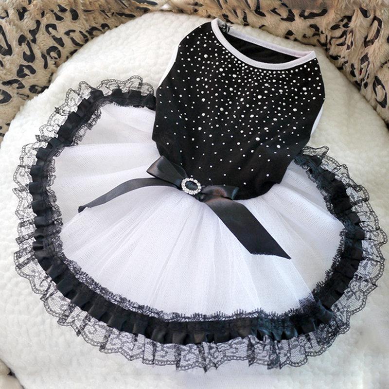 Black rhinestone bodice and white tulle pet dress flat lay