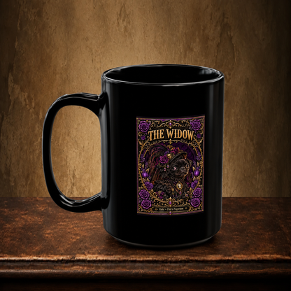 The Widow 15 oz black mug resting on a walnut tabletop against an antique plaster wall