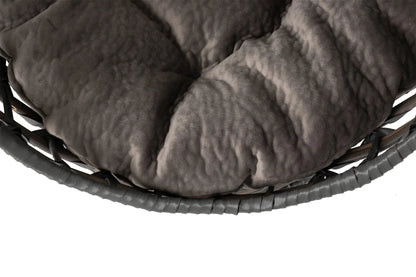 Close view of the plush smoky-gray tufted sleeping cushion